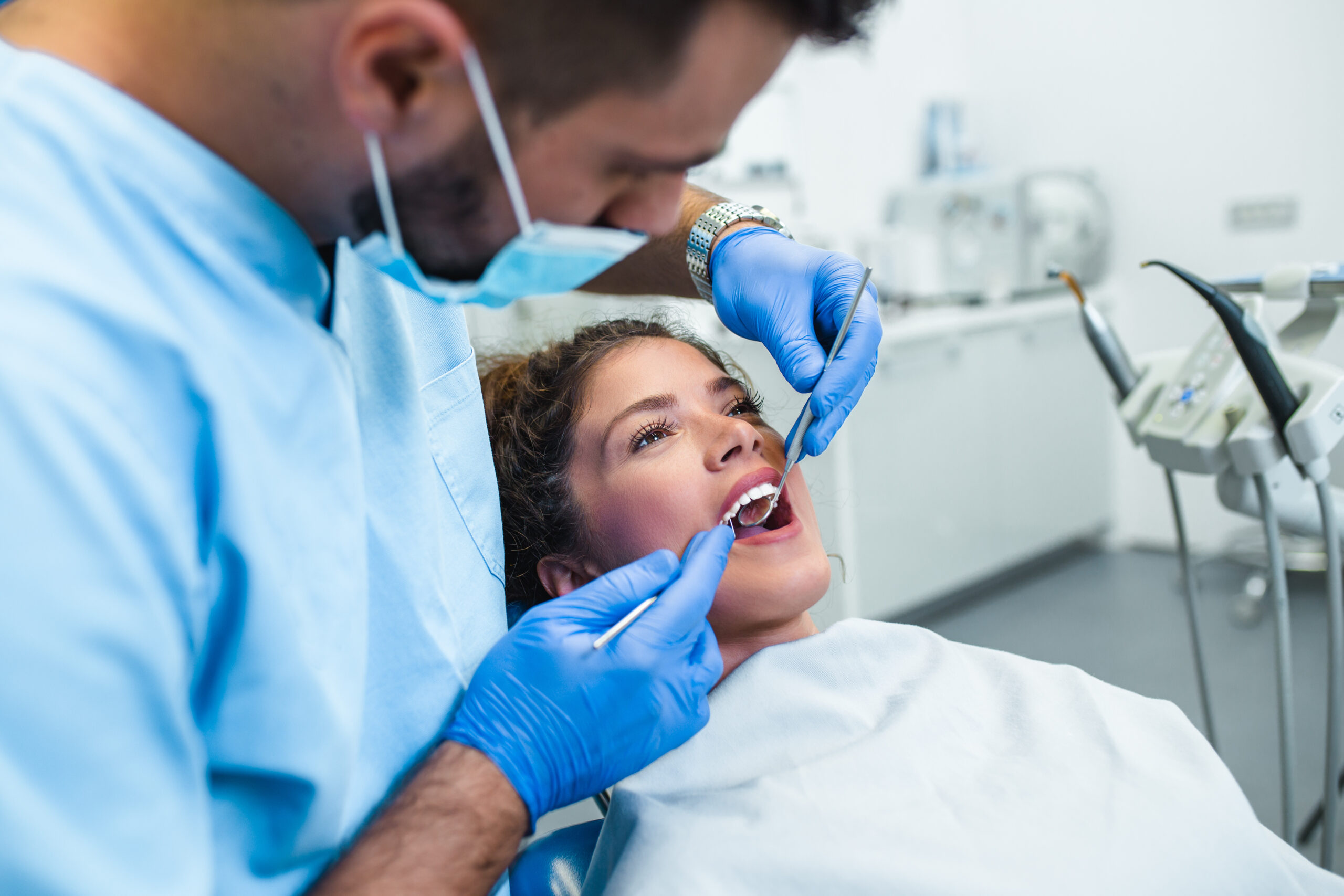 Young woman receiving dental treatment at a prosthodontist's office in Midtown East Manhattan